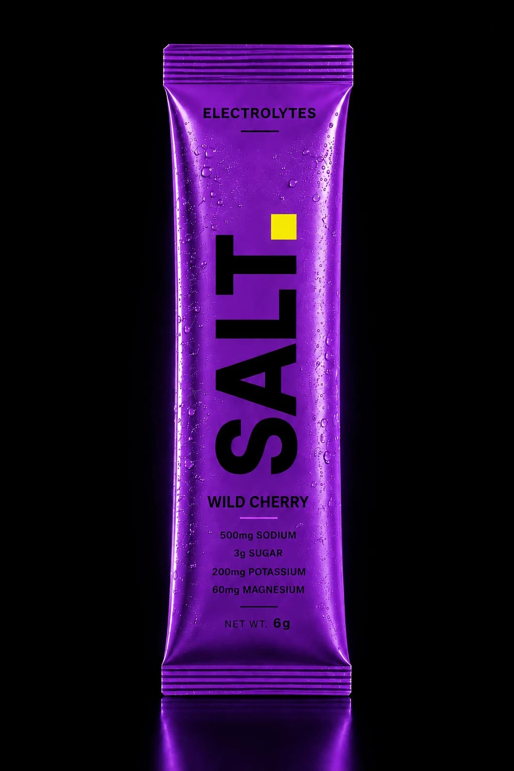 SOLT Wild Cherry sachet — vivid purple pack on a dark stage, 500mg sodium, 3g sugar per serve.
